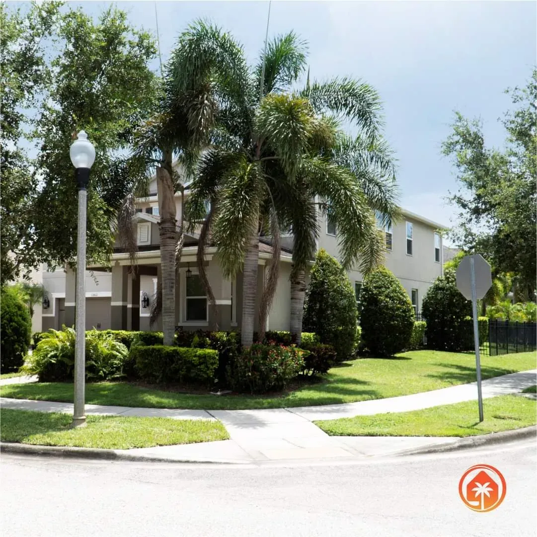Manicured Orlando front yard with royal palms, maintained by Doug's Landscape